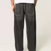 Jeans larghi skater con ricamo serpente nero lavato