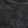 Jeans larghi skater con ricamo serpente nero lavato