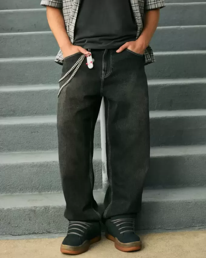 Jeans larghi skater con ricamo serpente nero lavato