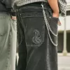 Jeans larghi skater con ricamo serpente nero lavato