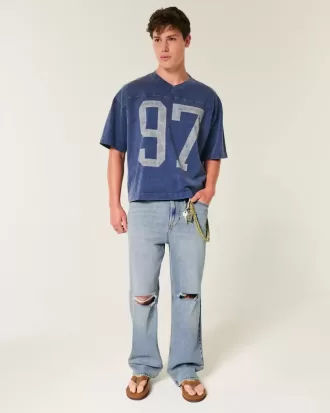 Jeans larghi strappati con lavaggio medio