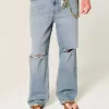 Jeans larghi strappati con lavaggio medio