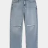 Jeans larghi strappati con lavaggio medio