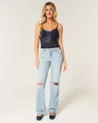 Jeans larghi strappati e lavaggio chiaro a vita bassa