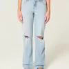 Jeans larghi strappati e lavaggio chiaro a vita bassa Jeans larghi strappati e lavaggio chiaro a vita bassa