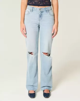 Jeans larghi strappati e lavaggio chiaro a vita bassa