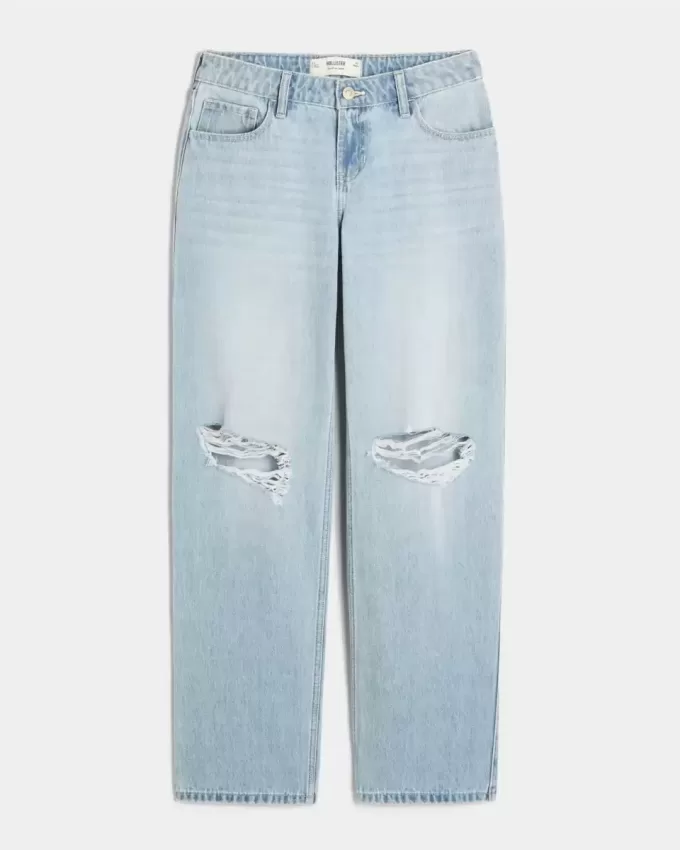 Jeans larghi strappati e lavaggio chiaro a vita bassa Jeans larghi strappati e lavaggio chiaro a vita bassa