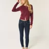 Jeans skinny lavaggio scuro a vita media Jeans skinny lavaggio scuro a vita media