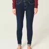 Jeans skinny lavaggio scuro a vita media Jeans skinny lavaggio scuro a vita media