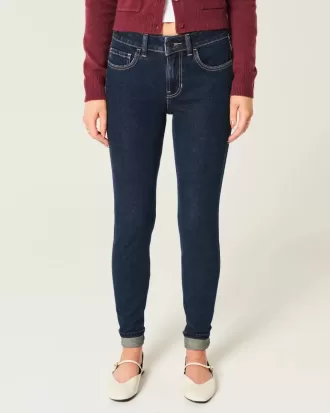 Jeans skinny lavaggio scuro a vita media