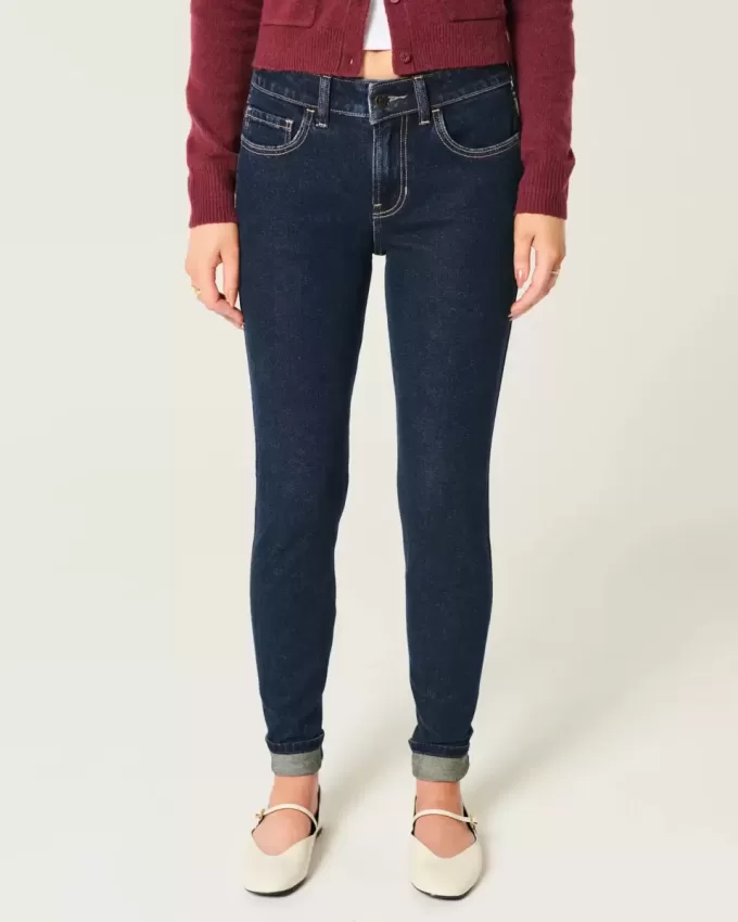 Jeans skinny lavaggio scuro a vita media Jeans skinny lavaggio scuro a vita media