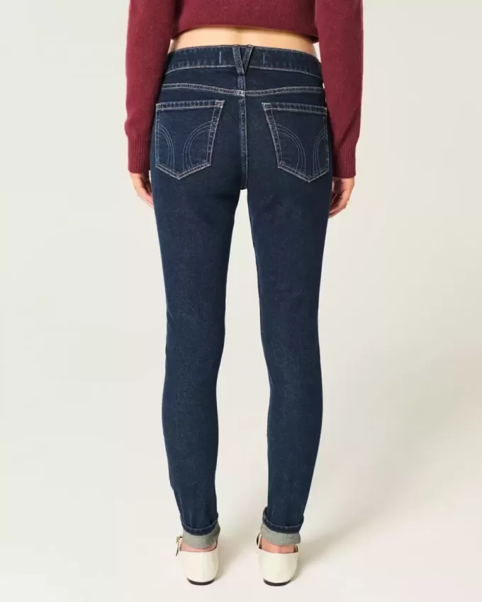 Jeans skinny lavaggio scuro a vita media Jeans skinny lavaggio scuro a vita media
