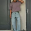 Jeans super larghi con grafica astronauta lavaggio chiaro