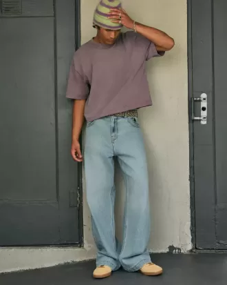Jeans super larghi con grafica astronauta lavaggio chiaro