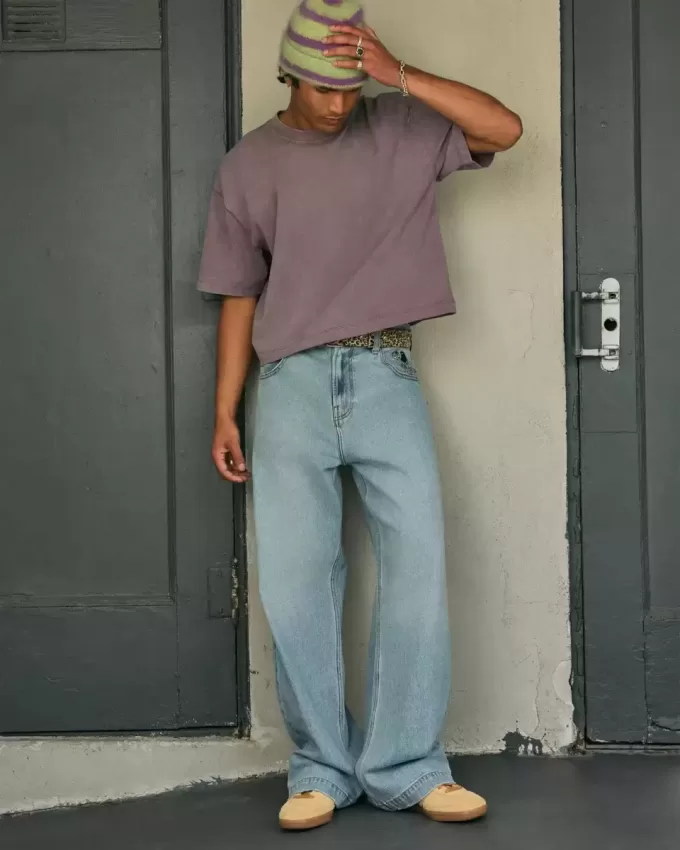 Jeans super larghi con grafica astronauta lavaggio chiaro