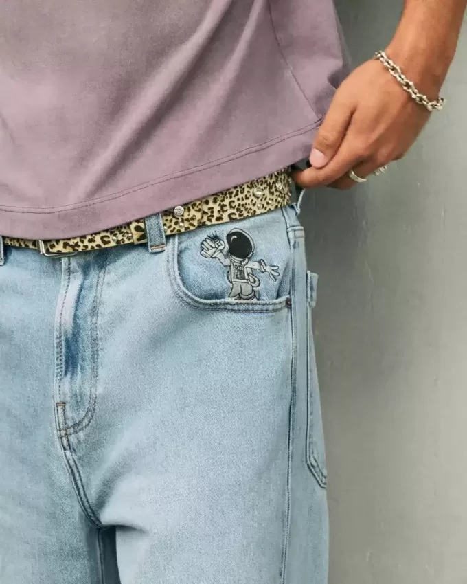 Jeans super larghi con grafica astronauta lavaggio chiaro