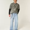 Jeans super larghi con grafica astronauta lavaggio chiaro
