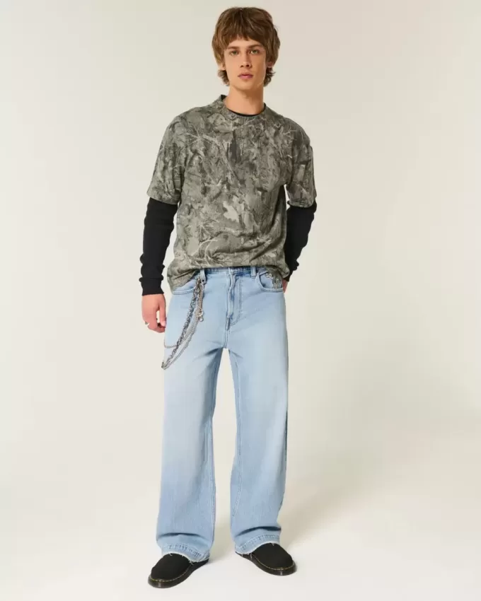 Jeans super larghi con grafica astronauta lavaggio chiaro
