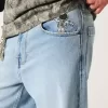 Jeans super larghi con grafica astronauta lavaggio chiaro