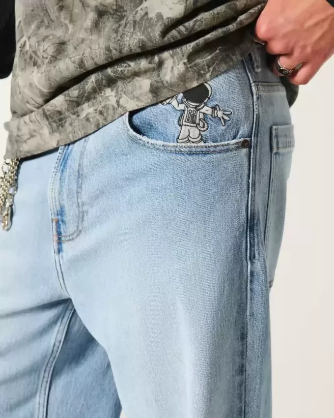 Jeans super larghi con grafica astronauta lavaggio chiaro