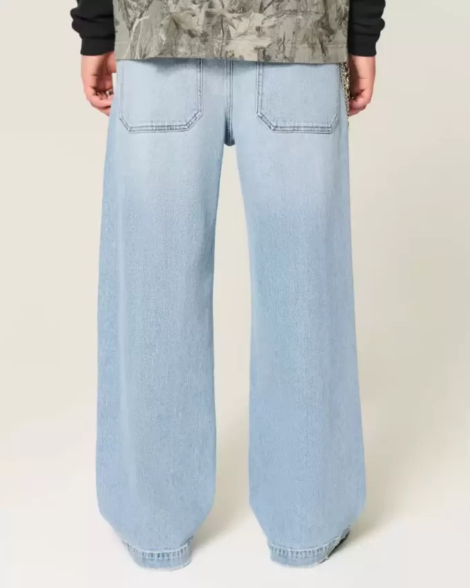 Jeans super larghi con grafica astronauta lavaggio chiaro