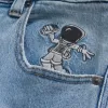 Jeans super larghi con grafica astronauta lavaggio chiaro