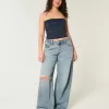 Jeans super larghi con lavaggio medio e vita bassa e strappi curvy