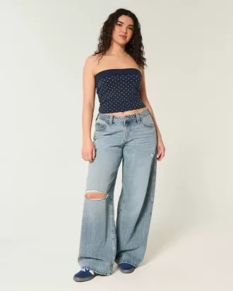 Jeans super larghi con lavaggio medio e vita bassa e strappi curvy