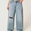 Jeans super larghi con lavaggio medio e vita bassa e strappi curvy