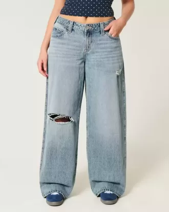 Jeans super larghi con lavaggio medio e vita bassa e strappi curvy