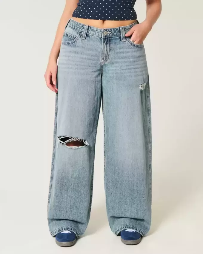 Jeans super larghi con lavaggio medio e vita bassa e strappi curvy