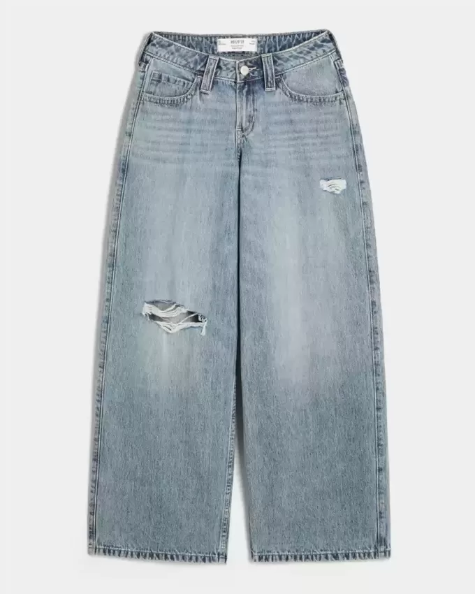 Jeans super larghi con lavaggio medio e vita bassa e strappi curvy