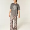 Jeans super larghi da pittore mimetici