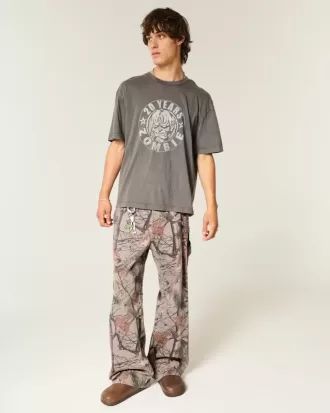 Jeans super larghi da pittore mimetici