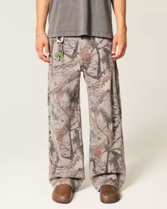 Jeans super larghi da pittore mimetici