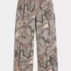 Jeans super larghi da pittore mimetici
