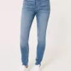 Jeans super skinny a vita alta con lavaggio medio