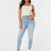 Jeans super skinny a vita alta con lavaggio medio e curve