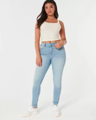Jeans super skinny a vita alta con lavaggio medio e curve