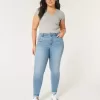 Jeans super skinny a vita alta con lavaggio medio e curve