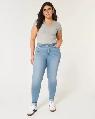 Jeans super skinny a vita alta con lavaggio medio e curve