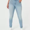 Jeans super skinny a vita alta con lavaggio medio e curve