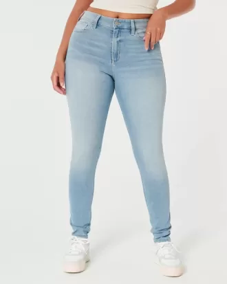 Jeans super skinny a vita alta con lavaggio medio e curve