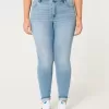 Jeans super skinny a vita alta con lavaggio medio e curve