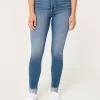 Jeans super skinny a vita alta con lavaggio medio e curve