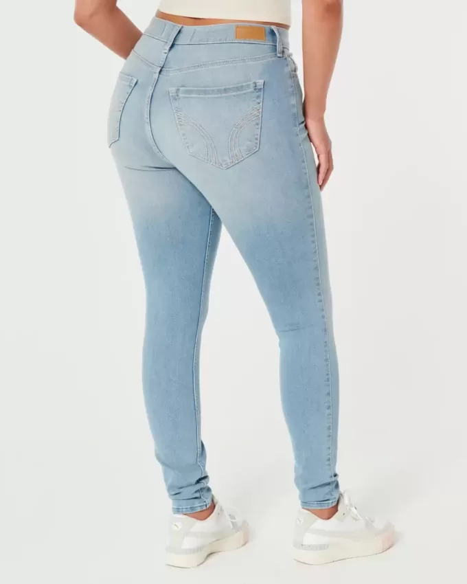 Jeans super skinny a vita alta con lavaggio medio e curve