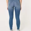 Jeans super skinny a vita alta con lavaggio medio e curve