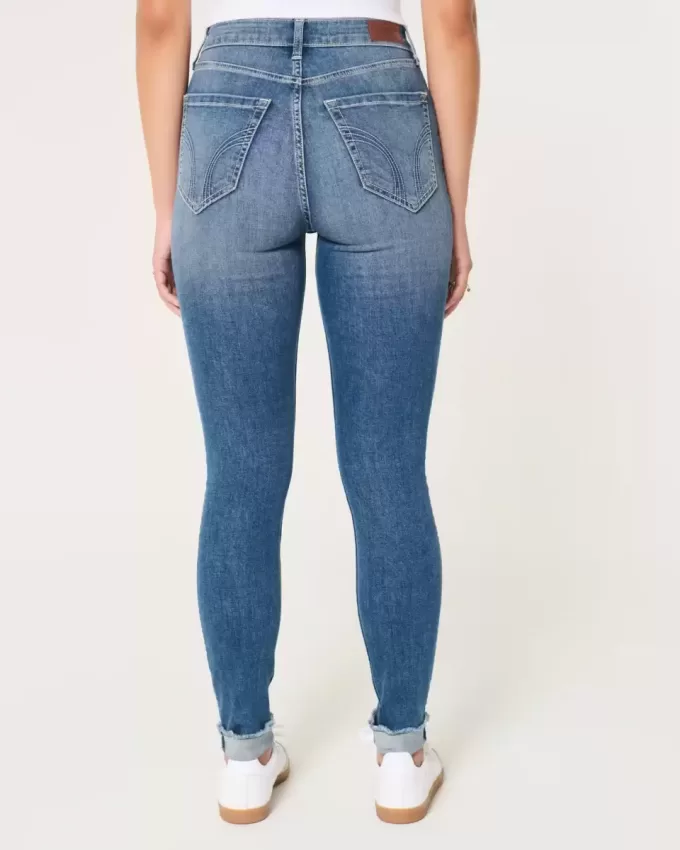 Jeans super skinny a vita alta con lavaggio medio e curve