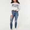 Jeans super skinny a vita alta con strappi e lavaggio medio
