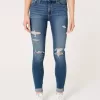 Jeans super skinny a vita alta con strappi e lavaggio medio